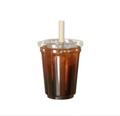 a drink in a plastic cup with a candle sticking out of the top, on a white background