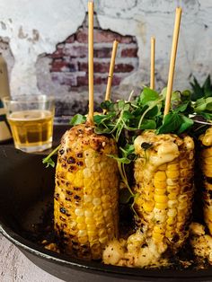 grilled corn on the cob with garnish and herbs