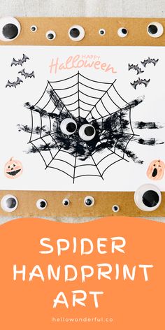 a spider handprint art project for kids with spooky eyes and bats on it