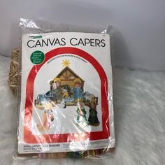 a package of canvass sitting on top of a white furnishing covered floor