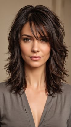 The V-cut layers haircut is distinguished by its sharp angles and clear definition, making it an excellent choice for those wanting to add a geometric element to their hairstyle. This cut is particularly effective on long hair and creates an illusion of length and volume. It works well with both straight and wavy hair, giving a dramatic flair to the overall appearance. Messy Layered Hair With Bangs, Dark Brown Hair With Highlights For Women Over 50, Short Shag Haircuts For Straight Hair, Hair Cuts With Face Framing Layers, Short Layers On Top Long On Bottom Hair, Long Layers For Fine Hair, V Haircut For Medium Hair, Medium Hair With Bangs And Layers, Layered Shaggy Hair