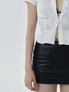 Refine your look with the sleek contouring of our Skinny Pencil Faux Leather Mini Skirt, designed to add a touch of edgy sophistication to any ensemble. Crafted from high-quality faux leather, this mini skirt features a figure-hugging silhouette that accentuates the hips while maintaining comfort with its elastic composition. The smooth texture and versatile black hue make it a standout choice for those seeking a blend of modern style and timeless appeal. Whether teamed with a casual tee and sne Elegant High Waist Faux Leather Mini Skirt, Fitted High Waist Faux Leather Mini Skirt, Sleek Knee-length Faux Leather Skirt, Elegant High-waist Faux Leather Mini Skirt, Club-ready Faux Leather Pencil Skirt, Faux Leather Mini Skirt, Leather Mini Skirts, Casual Tee, Leather Mini