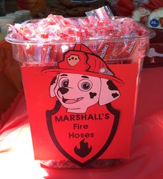 a cup with marshmallow's fire hoses in it