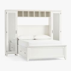 a white bed frame with drawers underneath it