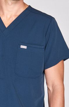 Double pocket men's performance scrub top with a modern, streamlined look. Four-way stretch and moisture-wicking fabric keep you comfortable. Medical Scrubs Men, Dark Harbor, Male Doctor, Black Fig, Good Doctor, Medical Scrubs, Scrub Tops, Moisture Wicking Fabric, Scrubs