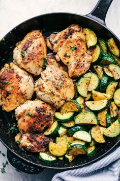 chicken, zucchini and squash in a skillet