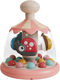 a small toy machine with lots of balls in it