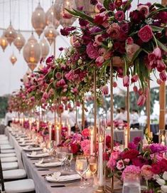 a long table with lots of flowers and candles on it is shown in an instagram