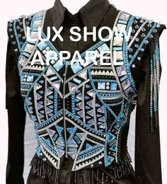 a black shirt with blue and silver designs on it's chest, that says luxury show apparel