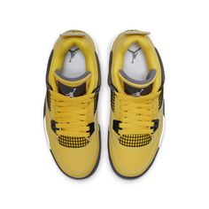 The Air Jordan 4 Retro GS 'Lightning' is back for the 2021 season. This sneaker was originally released in 2006 and was a popular choice among grade schoolers. The bright yellow nubuck upper with black molded eyelets and netting makes this sneaker stand out, as does the dark grey accents on the wings, interior tongue, and Jumpman logo. The white foam midsole provides comfort and support, while the visible Air-sole cushioning in the heel ensures a smooth ride. Jordan 4’s, Sneakers For Kids, Jordan Model, Air Jordan 13 Retro, Jumpman Logo, Dark Blue Grey, Jordan 13 Retro, Air Jordan 11 Retro, Jordan 4 Retro