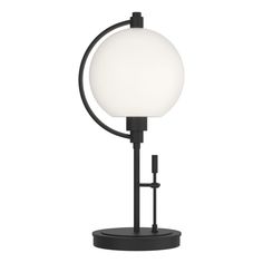 a black table lamp with a white ball on it