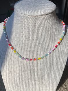 "For all you bright and beautiful people out there interested in statement jewelry, pearls and rainbows!! Measurements: - Chain length: 14\" with a 2\" inch extension chain (16\" total) - Bead measurements: 3 mm rainbow seed beads with 4 mm Satin Luster Pearl Beads Materials: - Chain extension material: 925 sterling silver (Tarnish resistant) - Necklace itself made with .4 mm strong clear elastic for extra comfort!! - Satin Luster Pearl Beads, Glass seed beads, Sterling silver lobster claw closu Seed Beads Necklace Patterns, Rainbow Beads Necklace, Rainbow Pearl Beaded Necklace As A Gift, Rainbow Necklace Beads, Handmade Rainbow Beaded Choker Necklaces, Seed Bead Necklace Ideas, Rainbow Pearl Beaded Necklaces, Seed Bead Necklace Rainbow, Rainbow Pearl Necklace