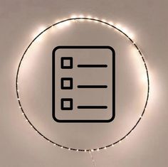 a circle with some lights around it and a checklist on the wall behind it