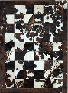 a cowhide rug with brown and white squares