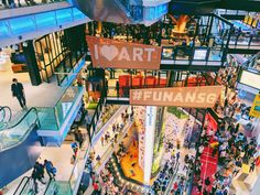 an overhead view of a shopping mall filled with people