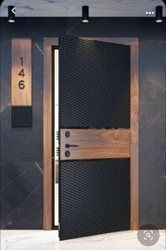 an open door with two numbers on the front and side panels that are made out of wood