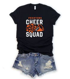 Customize this cheer shirt to meet your needs! Choose from short sleeve, long sleeve, hoodies, and crewneck sweatshirts and add your mascot and first or last name! Other color options and styles are available. If you don't see what you're looking for send us a message! The shirts are a UNISEX retail fit - they are more of a relaxed fit and may run a little large on women and those with a smaller frame. Make sure to see the size charts (last image) to confirm the best fit for you. We recommend me Black Tops With School Spirit For Cheerleading, Black Fan Apparel T-shirt For Cheerleading, Black T-shirt For Cheerleading Fan Apparel, Black Collegiate T-shirt For Cheerleading, Long Sleeve T-shirt With Team Name For Cheerleading, School Spirit T-shirt For Cheerleading During Sports Season, Long Sleeve T-shirt With Letter Print For Cheerleading, Retro Cheerleader, Cheer Camp Shirts