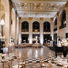 an elegant ballroom set up with tables and chairs