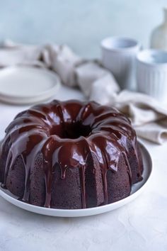 a bundt cake with chocolate icing on a plate