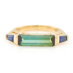 Celebrate timeless beauty and design with this breathtaking statement! This exquisitely modern east-west setting is a fresh take on fine jewelry. We love the visual flow of this ring on the finger.  Green tourmaline’s revitalizing energy refreshes the spirits. It nourished health and enhances vitality. This gorgeous ge Queer Jewelry, East West Ring, Green Tourmaline Ring, Tourmaline Jewelry, Modern Ring, Put A Ring On It, Sapphire Jewelry, East West, Green Tourmaline