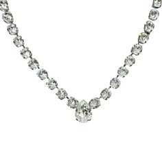 Shine bright like a pear-shaped diamond with our Swarovski Crystal Pear Necklace. The sparkling crystal, set in a rhodium-plated setting, adds a touch of elegance and dazzle to any look. Perfect for special occasions or adding a touch of glam to your everyday style. Pear-shaped Crystal Necklaces With Diamond Accents, Formal Pear-shaped Crystal Necklaces, Classic Teardrop Crystal Necklace, Teardrop Brilliant Cut Crystal Necklace, Classic Pear-shaped Crystal Jewelry, Classic Diamond White Rhinestone Necklace For Formal Occasions, Elegant Pear-shaped Rhinestone Jewelry, Teardrop Crystal Necklaces For Evening, Teardrop Crystal Necklace For Evening