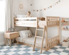 a child's bedroom with two bunk beds and a checkered rug on the floor