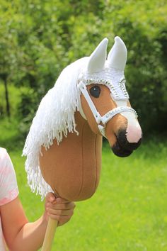 This Luxury EARBONNET and HALTER set is perfect for any hobby horse. The set is in bright white colour and has elegant decoration. Earbonnet is handknitted and sewn. The halter matches to the earbonnet so your horse is ready for fashion competion. This set adds a beautiful look to your hobby horse. We also have other colours ear bonnet sets avaiable. Our model is a caramel Hafling horse and you can find him in our other listing. All our horses and accessories are made with lots of love. If you h Hobby Horse Tack Ideas, Horse Ear Bonnet, Stick Horses, Bonnet Pattern, Horse Equipment, Horse Decor