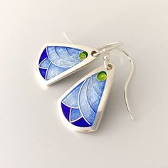 Cobalt Blue Lotus Flower Vitreous Enamel Earrings –Cloisonné & Champlevé Enamels on Fine Silver w/ Sterling Ear Wires by Sandra McEwenThese bright blue lotus earrings are a pure slice of summer.  They are delicate and easy to wear and add that touch of sunshine even in the most air-conditioned space!Materials: Champlevé & cloisonné Enamels on Fine silver.EarringsSize: .9” long x .5” wide All my jewelry is handmade by me in my studio in beautiful Wilmington, North Carolina.  ------------- Green Lotus Flower, Copper Enameling, Copper Etching, Enameled Jewelry, Cloisonne Enamel Jewelry, Cloisonne Jewelry, Colbalt Blue, Blue Lotus Flower, Lotus Earrings