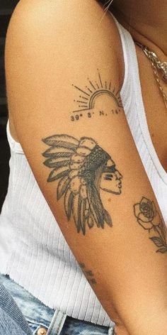 a woman with a tattoo on her arm