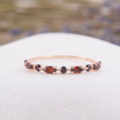 Tiny delicate vintage art deco garnet wedding ring, Small & dainty 14k rose gold marquise cut garnet womens wedding band, Garnet jewelry WE OFFER UNLIMITED PERIOD INSTALLMENTS PLAN This is a beautiful, stunning, feminine ring that works well for all occasions, styles, and ages. You will love it! Ring information: Stones: Garnets Approximate size: 4x2mm (4 stones) Approximate size: 2.0mm (5 stones) Metal type: Gold Metal stamp: 14k Gold Installment Payments We offer installment payments for a Elegant Stackable Garnet Jewelry, Elegant Marquise Garnet Jewelry, Dainty Garnet Jewelry For Anniversary, Plain Gold Wedding Bands, Garnet Wedding Rings, Garnet Wedding, Simple Wedding Bands, Wedding Bands For Her, Custom Wedding Band