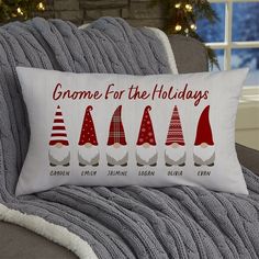 a christmas pillow that says gnome for the holidays on it, and five different hats