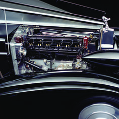 the engine compartment of an old car is shown