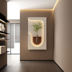 an empty room with a plant in a vase on the wall and bookshelves