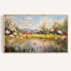 a painting hanging on the wall next to a lake with pink flowers and mountains in the background