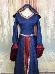 The medieval fantasy lady's dress, in blue damask and silver duchesse, features lined sleeves and a shoulder-length neckline, the black and silver edges have an intricate Celtic-style dragon design. the skirt does not have a train, the sleeves are castellana cut, the bodice with a back weave fits your figure perfectly You can choose the colors of the dress. Color on photos: main color - dark blue, second color -burgundy If you need other color combinations or other design - please contact me! Es Blue Medieval Dress, Damask Dress, Celtic Style, Medieval Dress, Medieval Clothing, Fantasy Dress, Dragon Design, Fashion Design Sketches, Medieval Fantasy