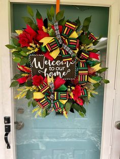 a welcome to our home wreath hanging on the front door