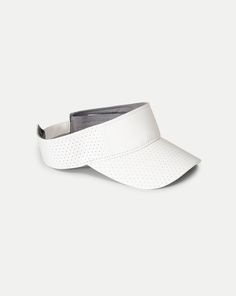 Made from vegan leather, this sporty visor features a perforated design for ventilation and an adjustable closure for a custom fit. Great for keeping distractions at a minimum during play, it's equally chic off the court. Part of our tennis capsule in collaboration with activewear brand L’Etoile Sport.100% Polyester Velcro closure Brim: 2 3⁄4" Spot clean Style #V002-1 Sporty Visor, White Veronica, Activewear Brands, Veronica Beard, The Court, Custom Fit, Vegan Leather, Tennis, Active Wear