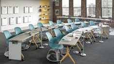 an empty classroom with desks and chairs