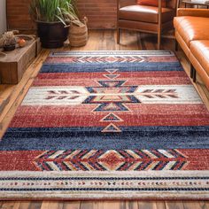 a red, blue and white rug in a living room