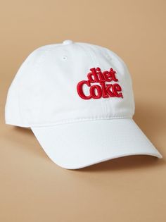 Get ready to add a refreshing twist to your hat collection with this iconic baseball cap! Emblazoned proudly on the front is the unmistakable Diet Coke logo, a symbol of style, taste, and a whole lot of fizz. The sleek design, coupled with the iconic logo, makes a bold statement wherever you go. It's a conversation starter, a fashion-forward choice, and a way to express your individuality. Trendy Snapback Hat With Logo, Trendy Curved Brim Hat With Logo, Retro White Dad Hat, Diet Coke Gift, White Logo Baseball Cap, Diet Coke Art Print, Diet Coke Sweatshirt, Diet Coke Glass Bottle, Vintage Coke Shirt