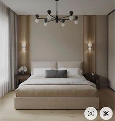 a large bed sitting under a chandelier next to a wall mounted light fixture