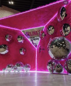 an artistic display with disco balls and mirrors