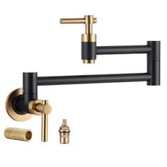 the brass faucet is attached to the black and gold kitchen faucet