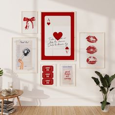 there are many pictures on the wall in this room and one has a red frame