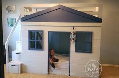 a child's bedroom with a doll house bed and stairs