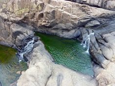 an aerial view of some rocks and water