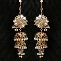 This earrings set go perfect with someone like you! Stunning gold-plated earrings crafted from mirror work kundan stones and pearl drops. Approximate earrings length is 3″. Luxury Gold Earrings With Mirror Work, Gold Chandbali Earrings With Mirror Work, Gold Jeweled Bollywood Danglers, Bollywood Style Jeweled Gold Danglers, Gold Earrings With Mirror Work For Party, Gold Temple Jewelry Danglers With Mirror Work, Gold Bridal Earrings With Mirror Work In Temple Style, Gold Temple Jewelry Bridal Earrings With Mirror Work, Gold Temple Bridal Earrings With Mirror Work