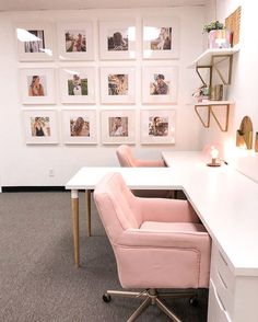 an office with pink chairs and pictures on the wall