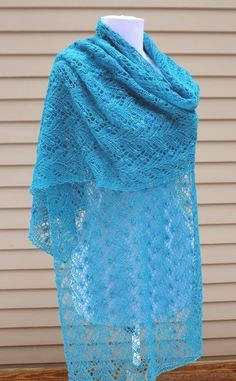 a blue shawl draped over a wooden table