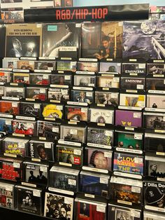 a wall full of cd's and cds with the words r & b / hip - hop on them